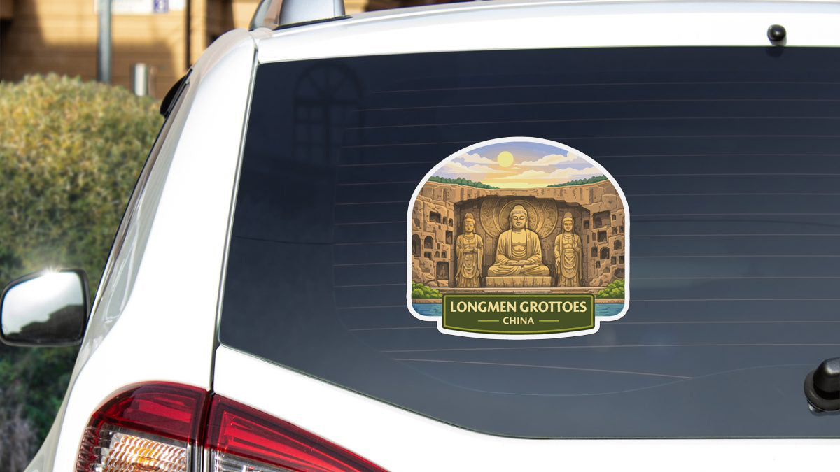 a sticker on the rear window of a car, depicting a scenic landscape with a large Buddha statue in the center.