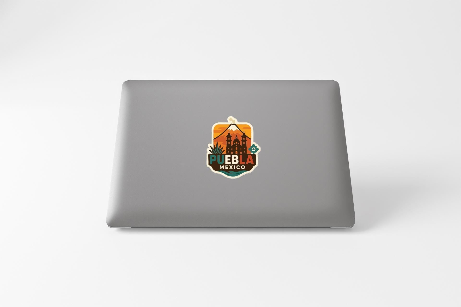 a sticker with a graphic of a building and text that says "Pueblo, Mexico".