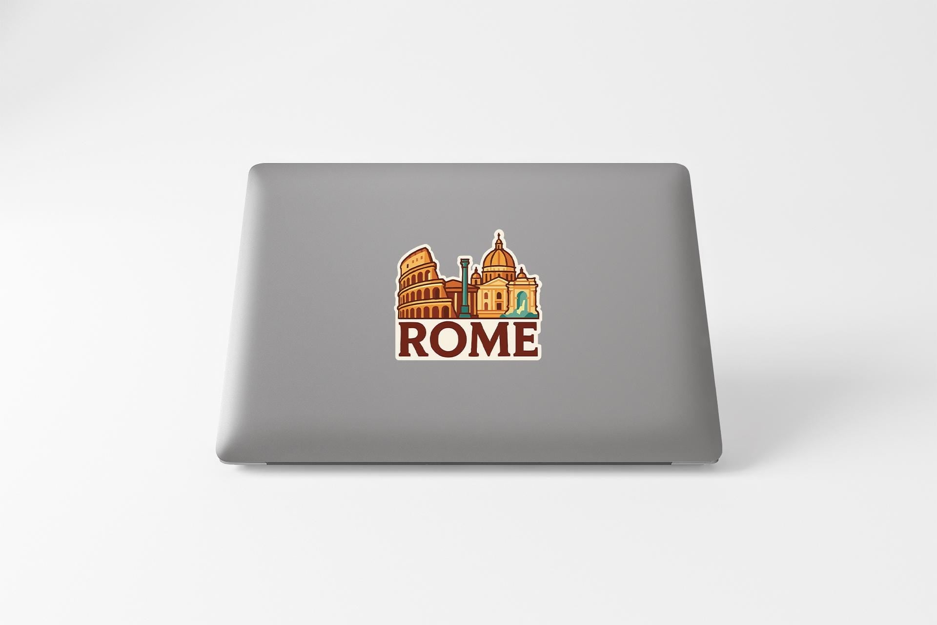 a laptop with a sticker of a city skyline