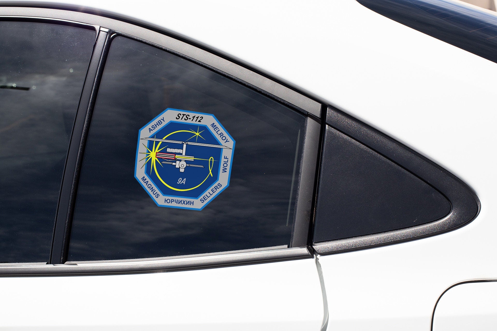 a close up of a car window with a sticker on it