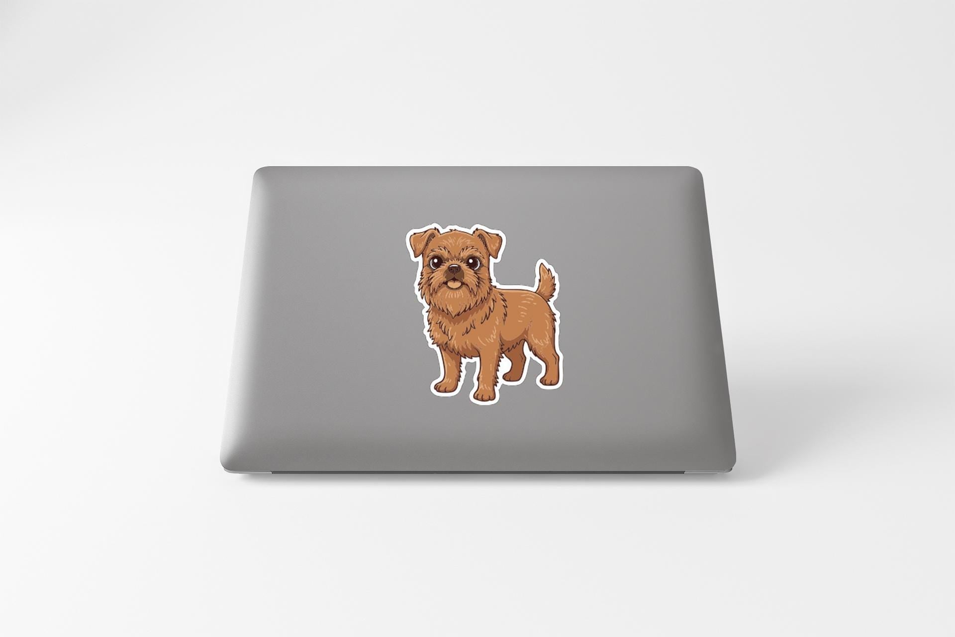 A sticker of a dog on the back of a laptop computer.