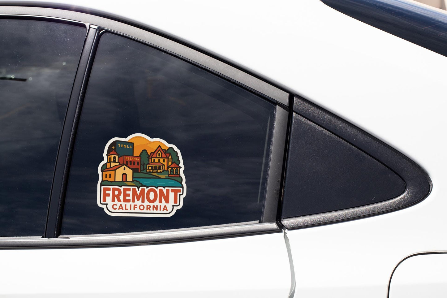 A sticker on the side of a car window that says "Fremont, CA".