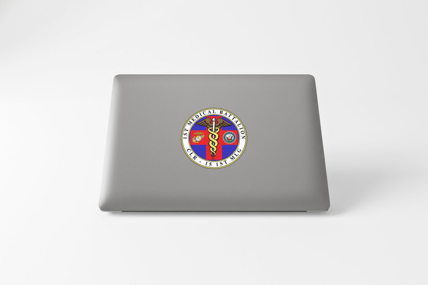 a laptop computer with a sticker of two people on it