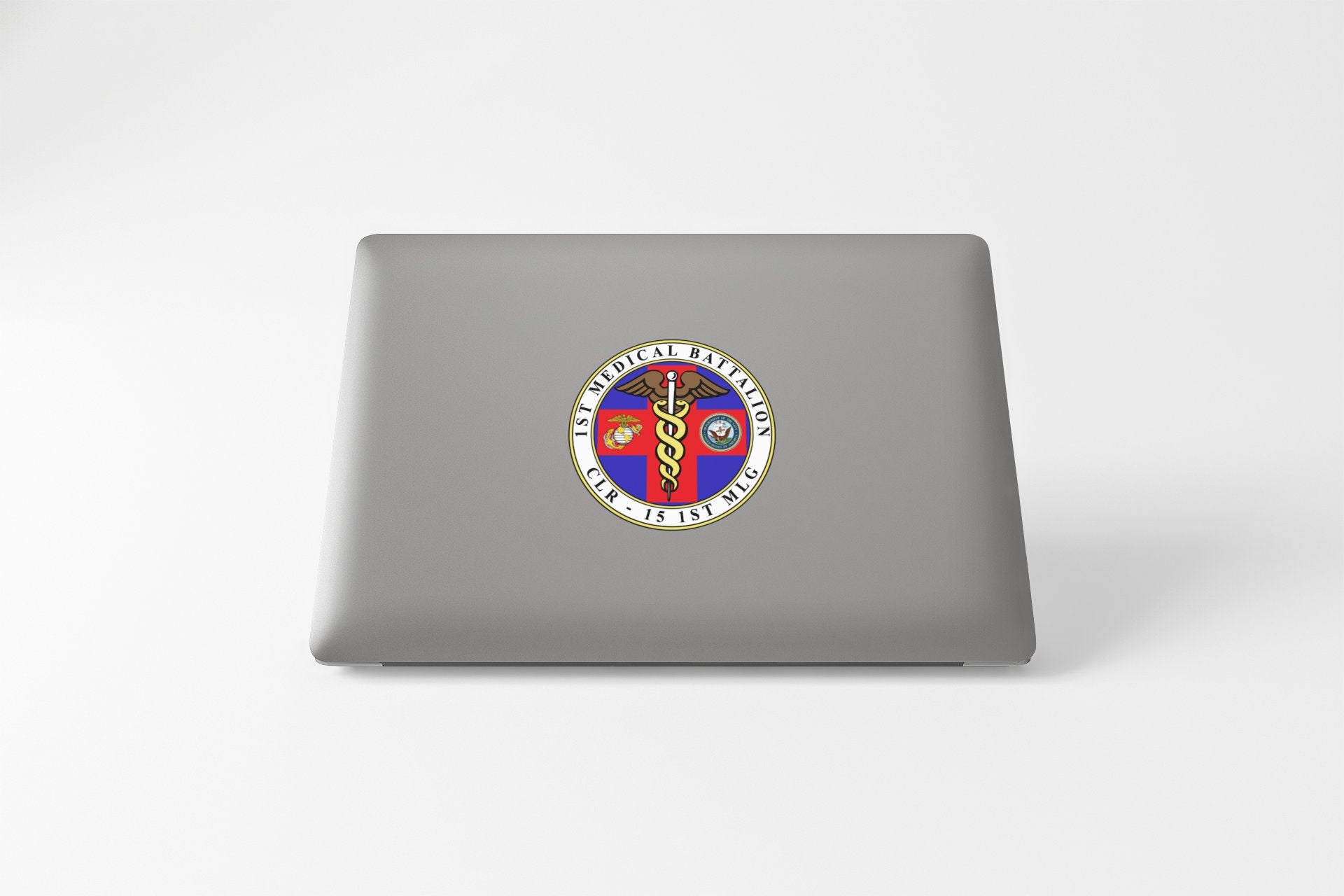 a laptop computer with a sticker of two people on it