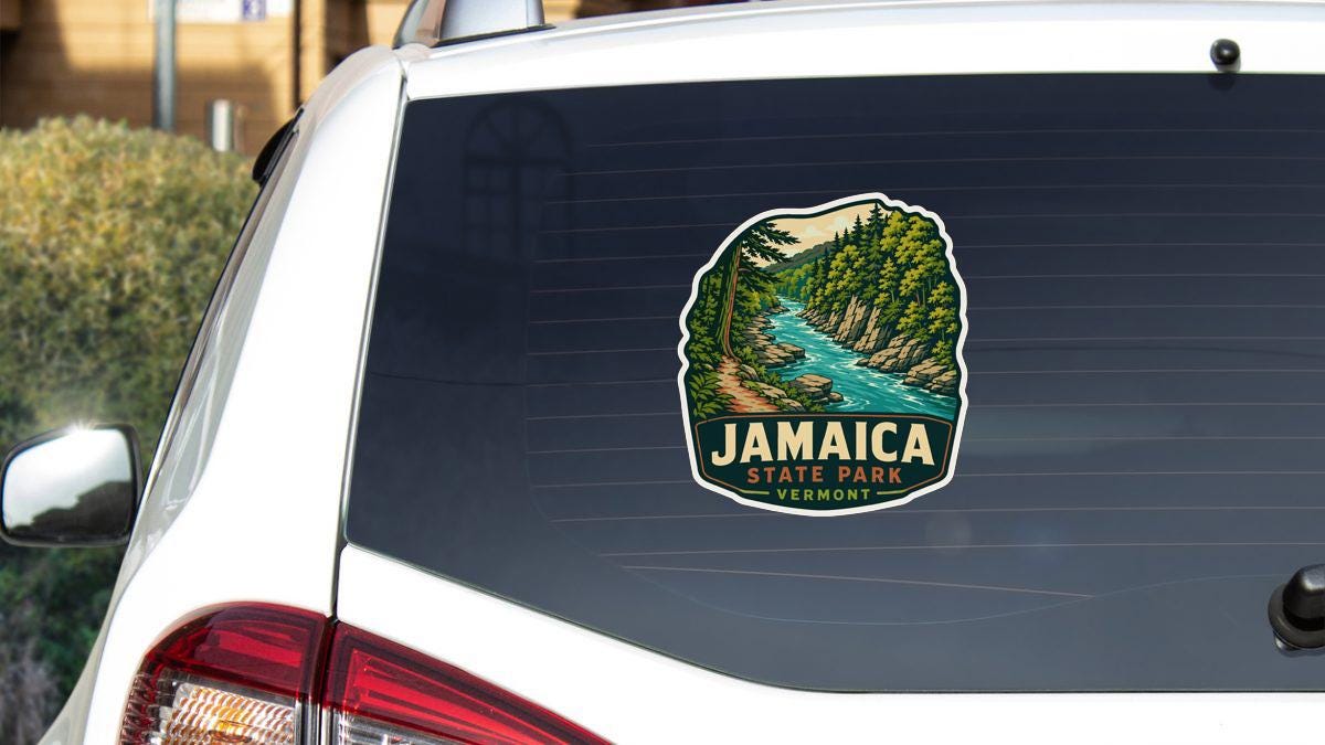 A sticker on the rear window of a white vehicle, depicting a scenic landscape with a river and forest.