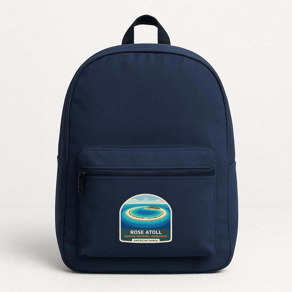 A navy blue backpack with a sticker on the front pocket.
