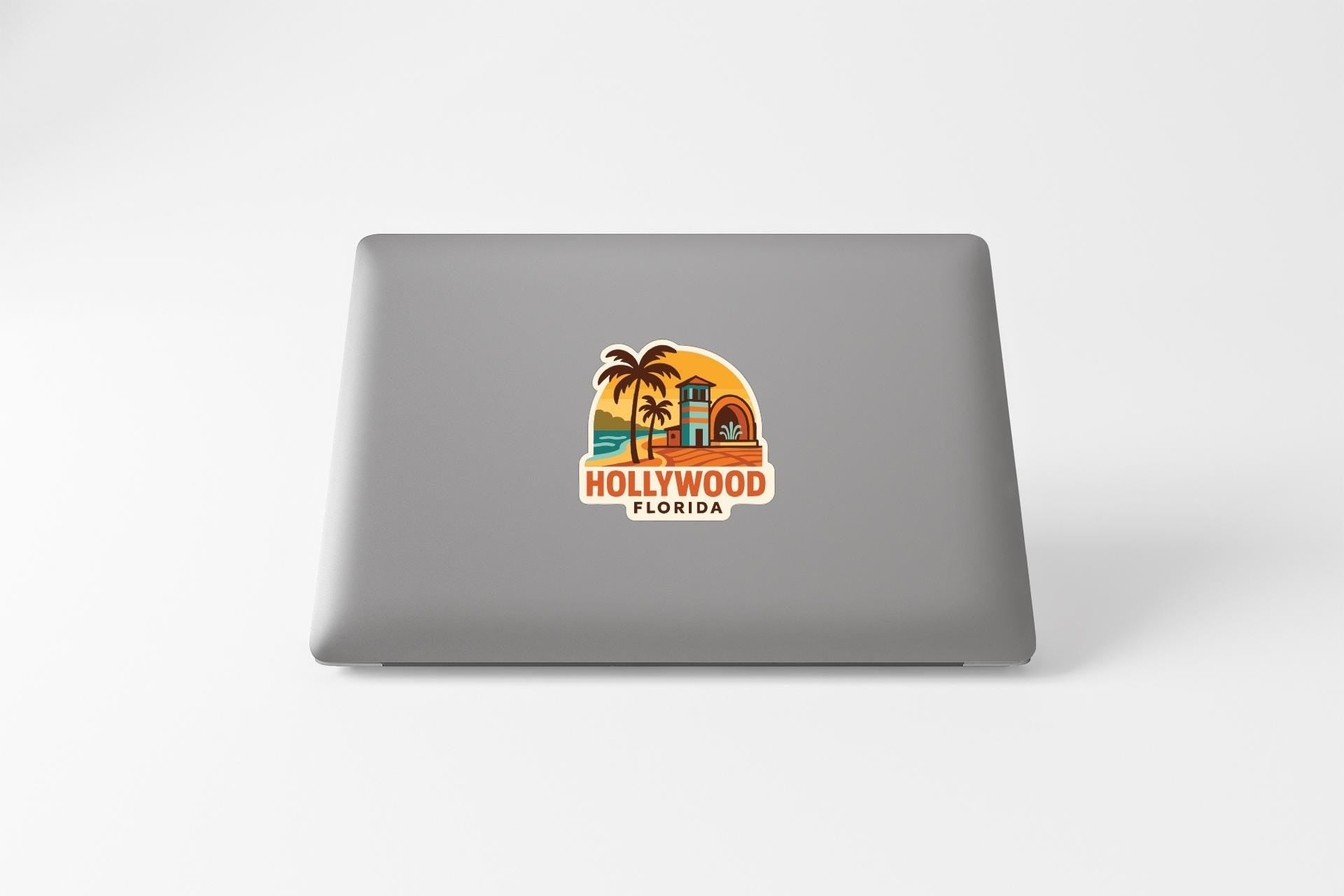 a sticker of Hollywood, Florida on the back of a laptop.