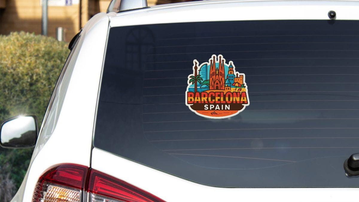 a sticker on the rear window of a car, featuring the city of Barcelona, Spain.