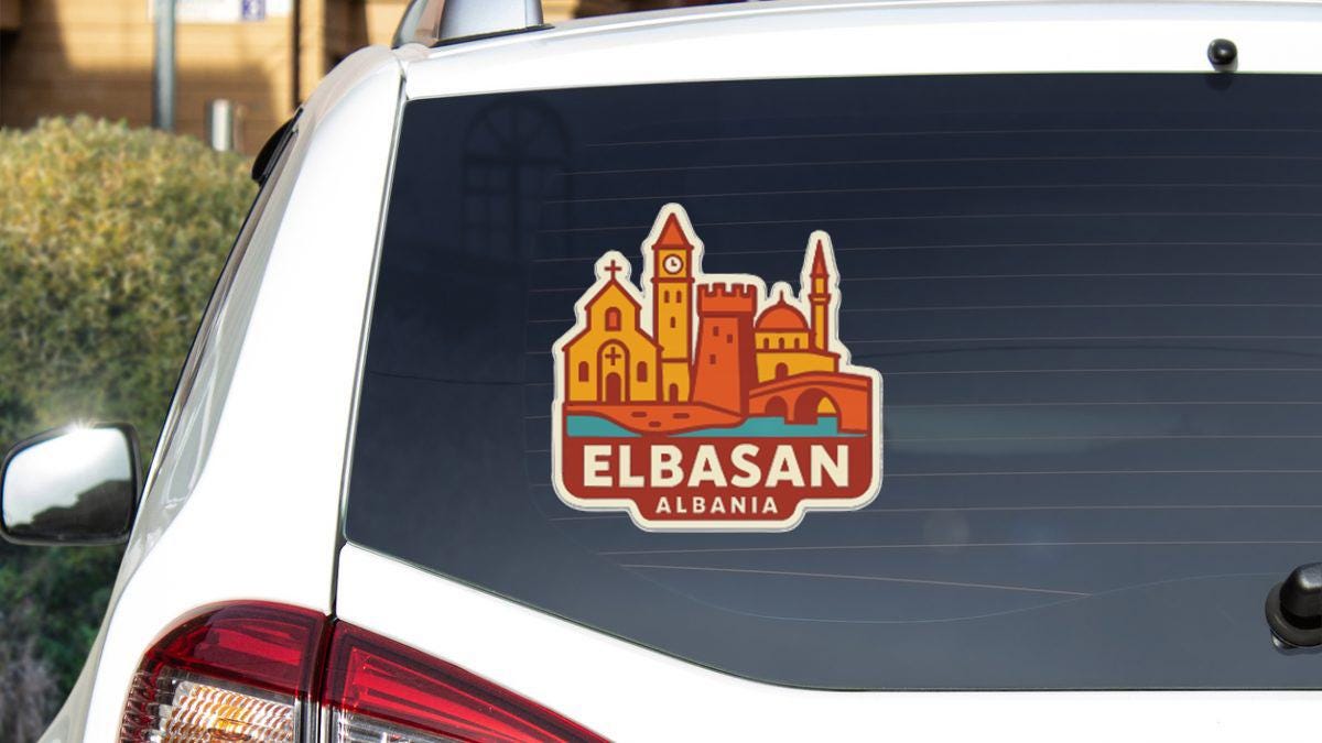 a sticker on the rear window of a car that displays the city of El Basan, located in the country of Algeria.