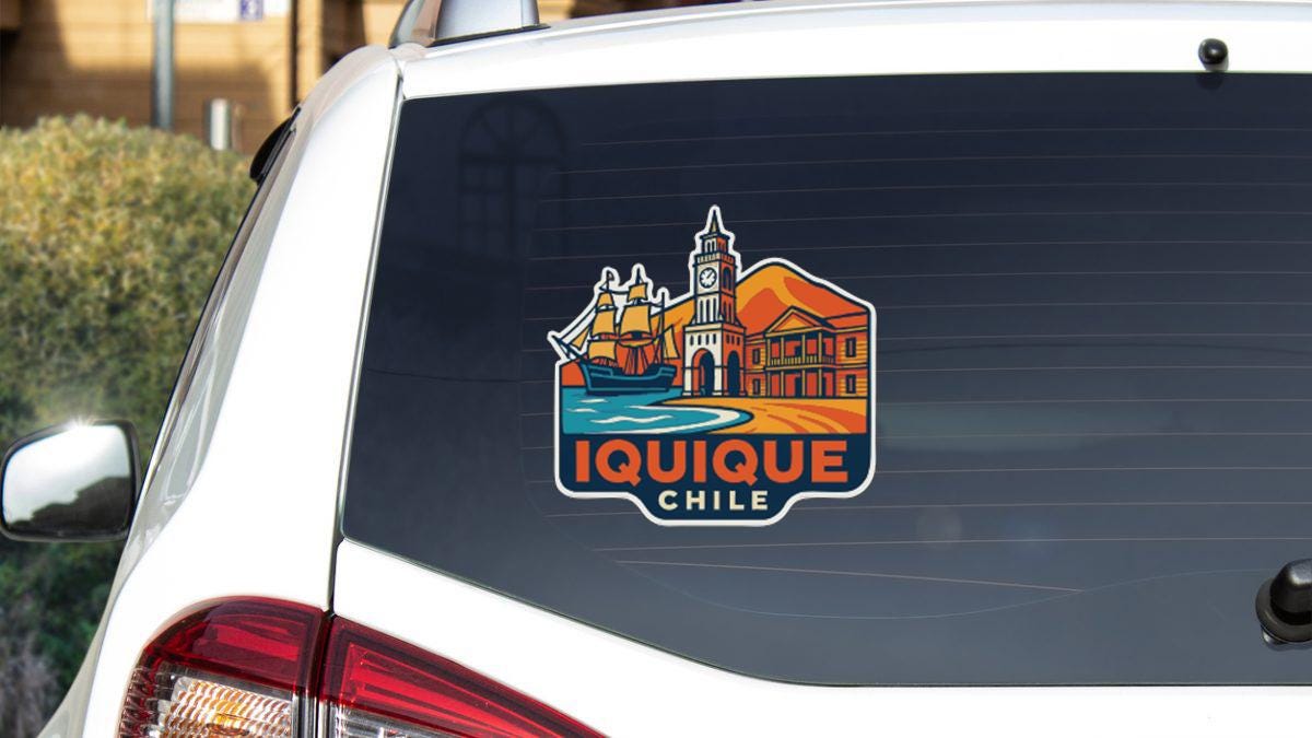 a sticker on the rear window of a car that says "Iquique Chile".