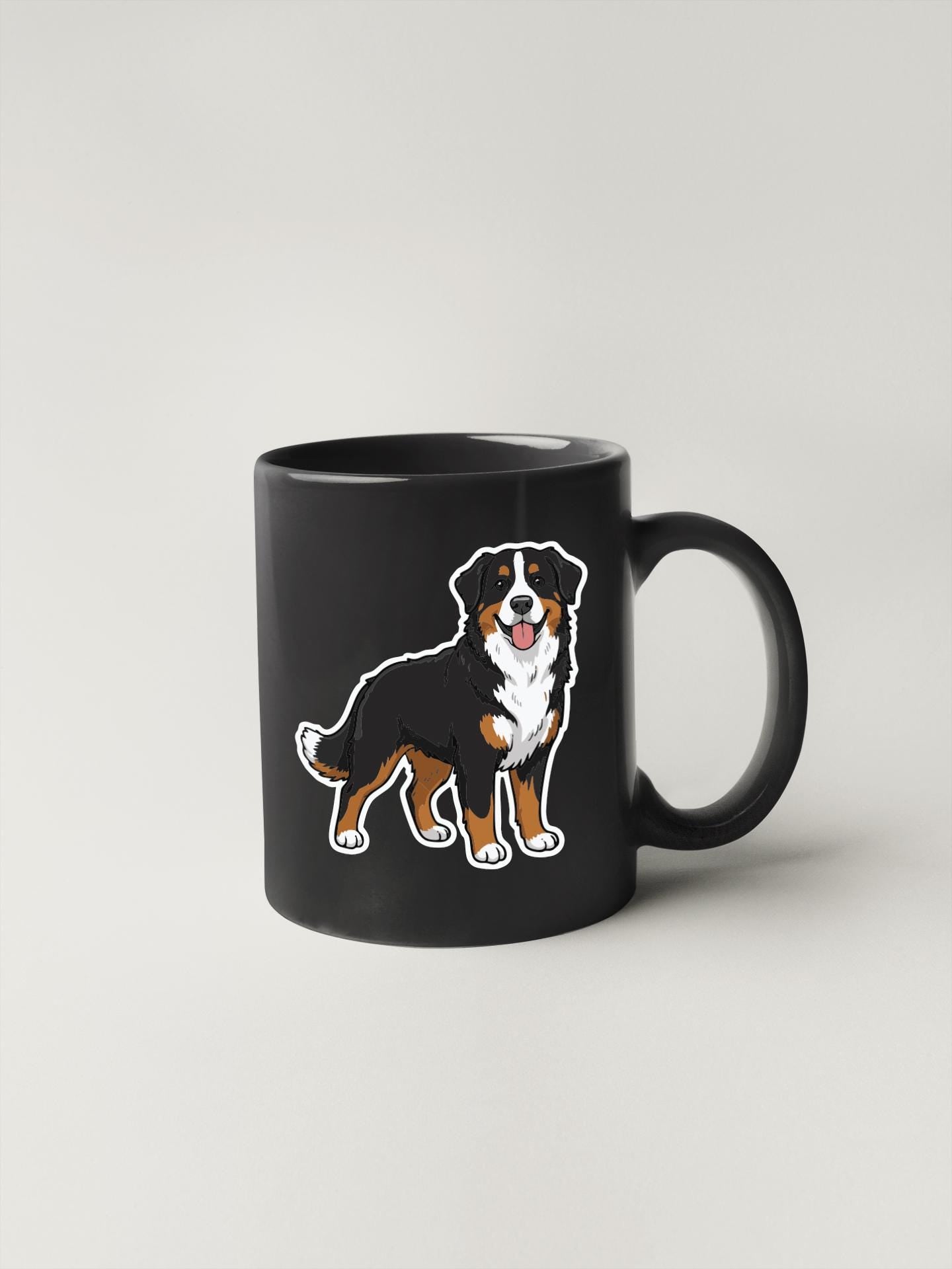 A black coffee mug with a cartoon illustration of a dog on it.