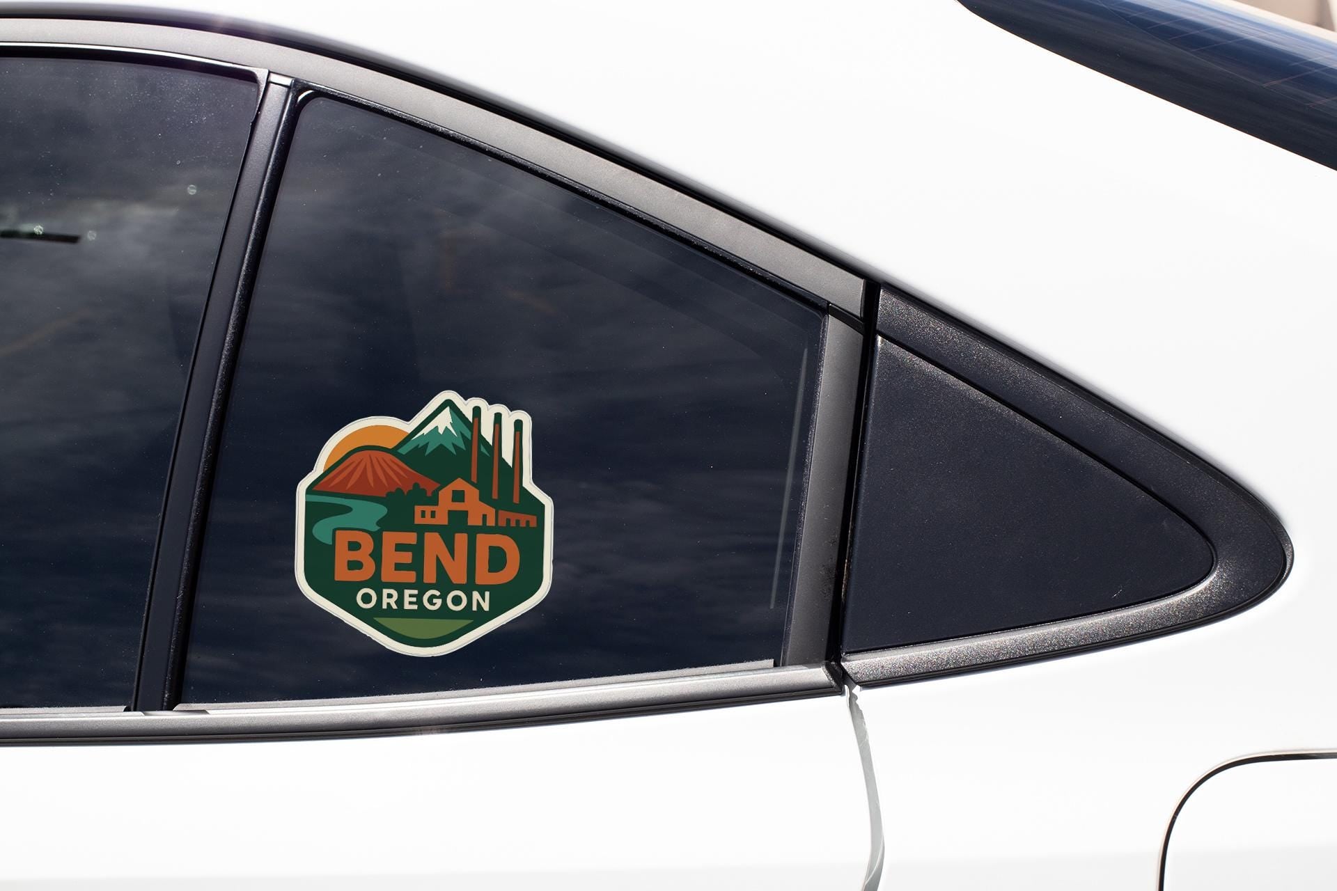 A sticker on the side of a car window that says "BEND OREGON".