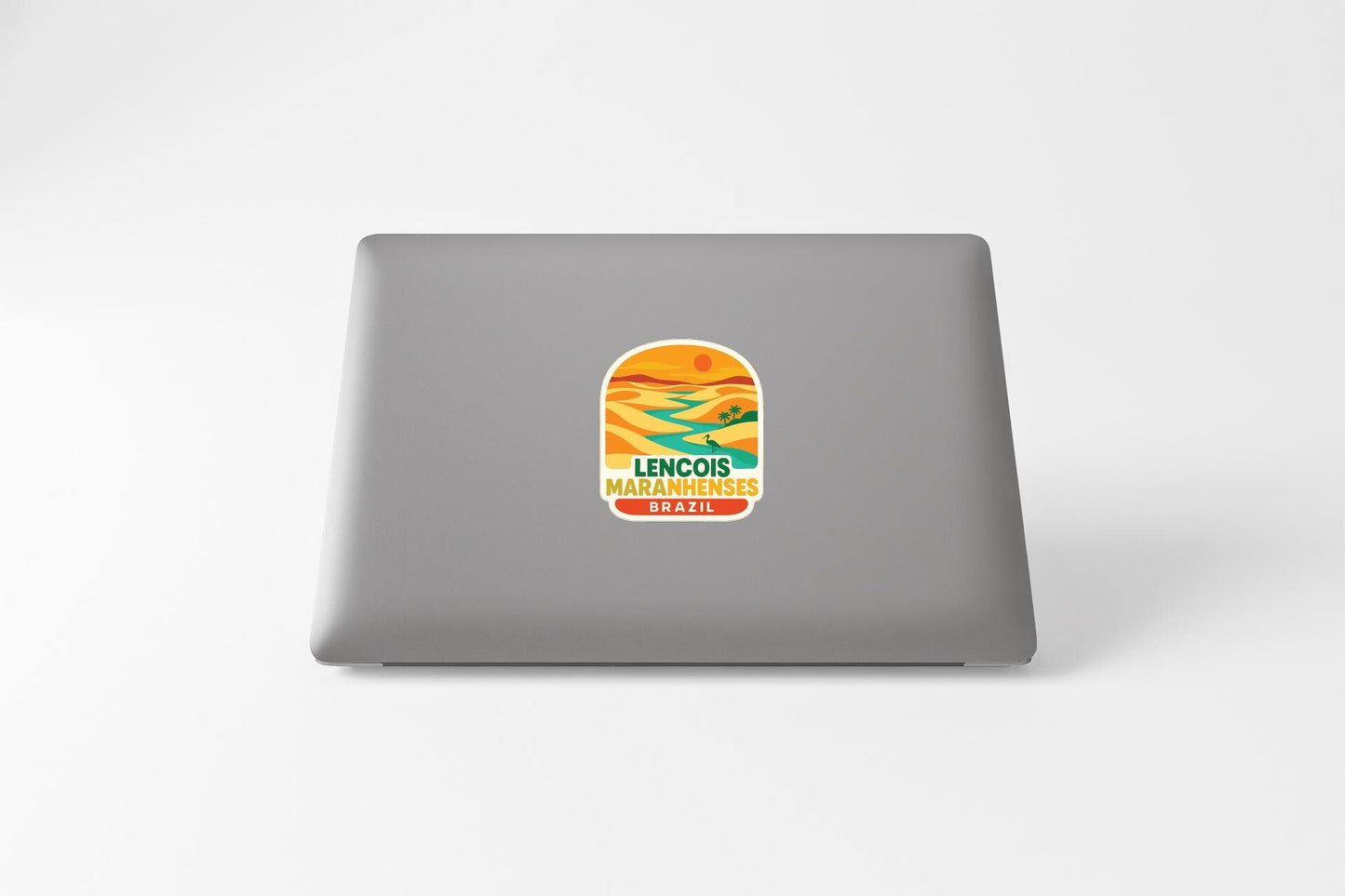 a sticker on the back of a laptop that says "LENCOIS MADAMENÕES BRAZIL".