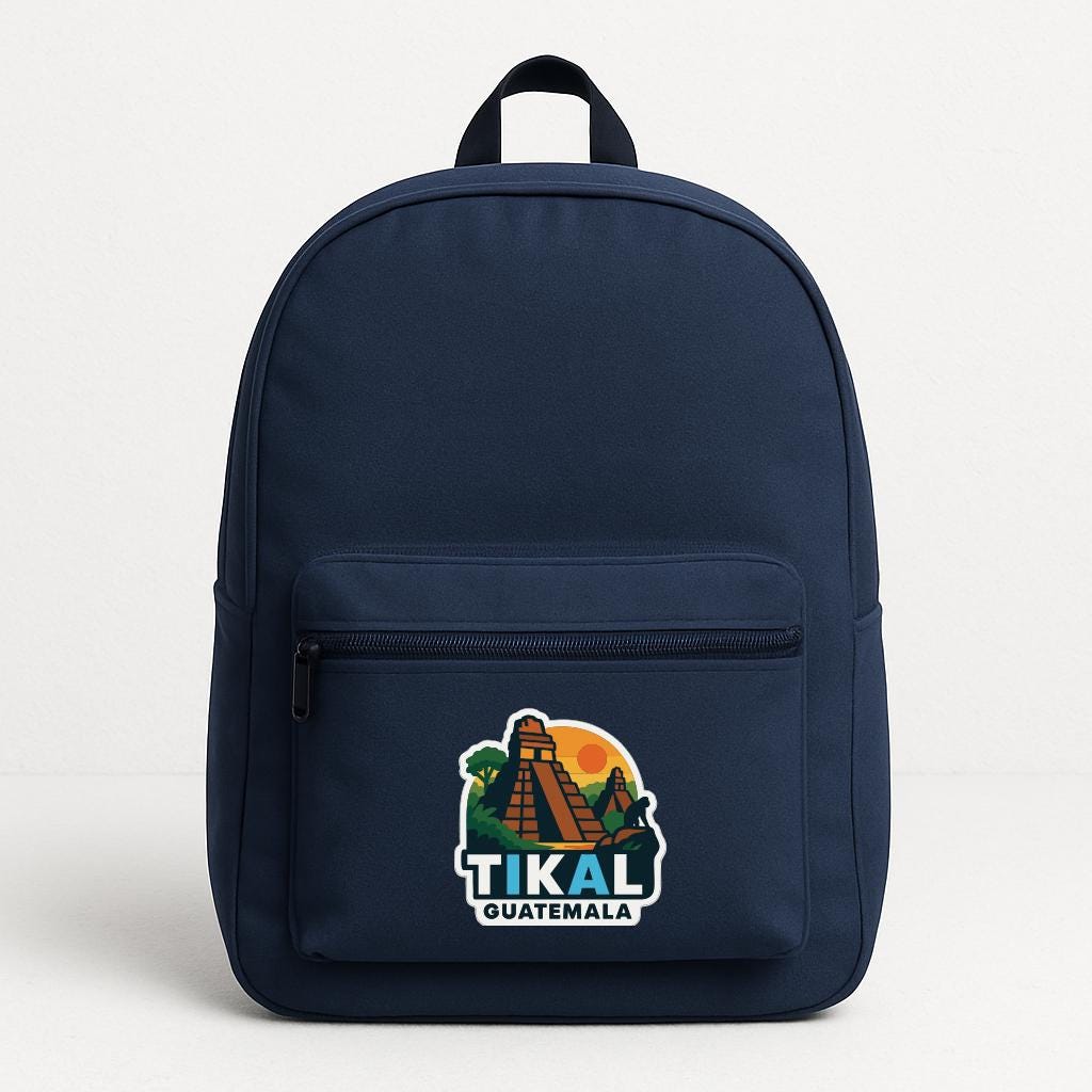 A navy blue backpack with a graphic of the Mayan city of Tikal, Guatemala, and the text "TIKAL GUATEMALA" printed on it.