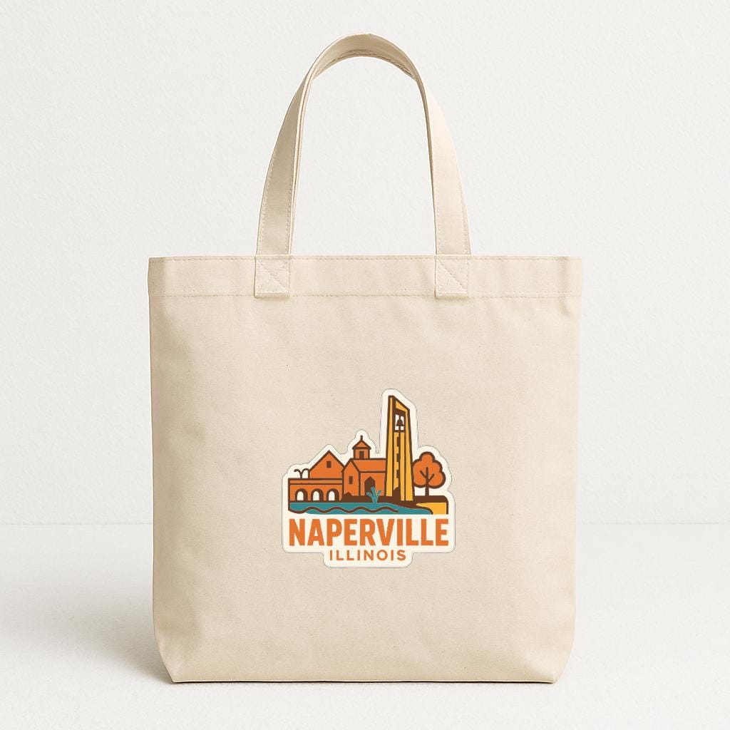 A beige tote bag with a printed logo depicting Naperville, Illinois.