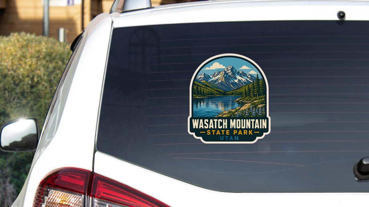 A sticker on the rear window of a car that says "Wasatch Mountain State Park - Utah".