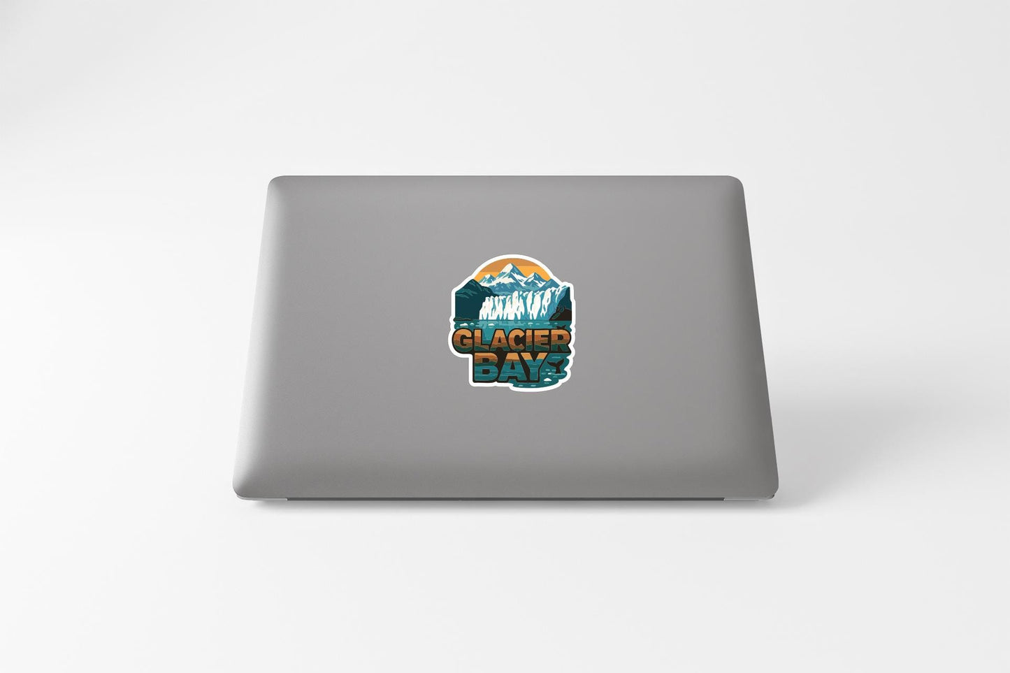 a sticker on the back of a laptop that says "Glacier Days".