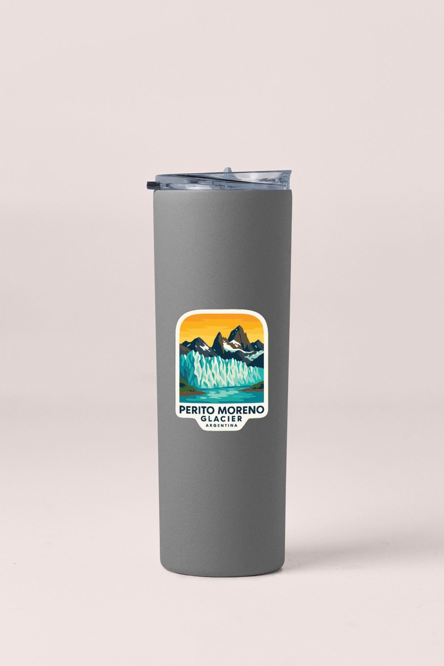 A gray insulated tumbler with a sticker featuring a mountain landscape.