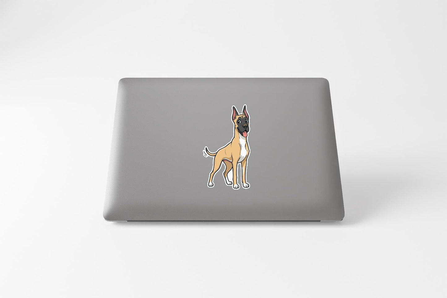 a sticker of a dog on the back of a laptop.
