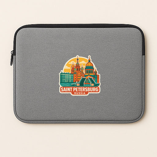 A gray laptop sleeve with a sticker depicting the iconic St. Petersburg Cathedral and surrounding buildings.