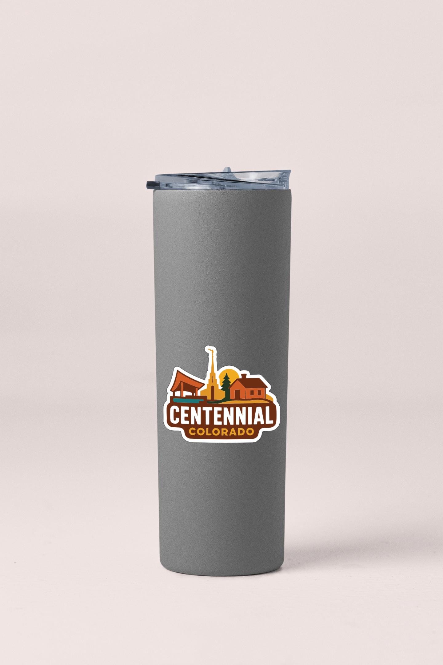 A gray insulated tumbler with a logo for Centennial Colorado.