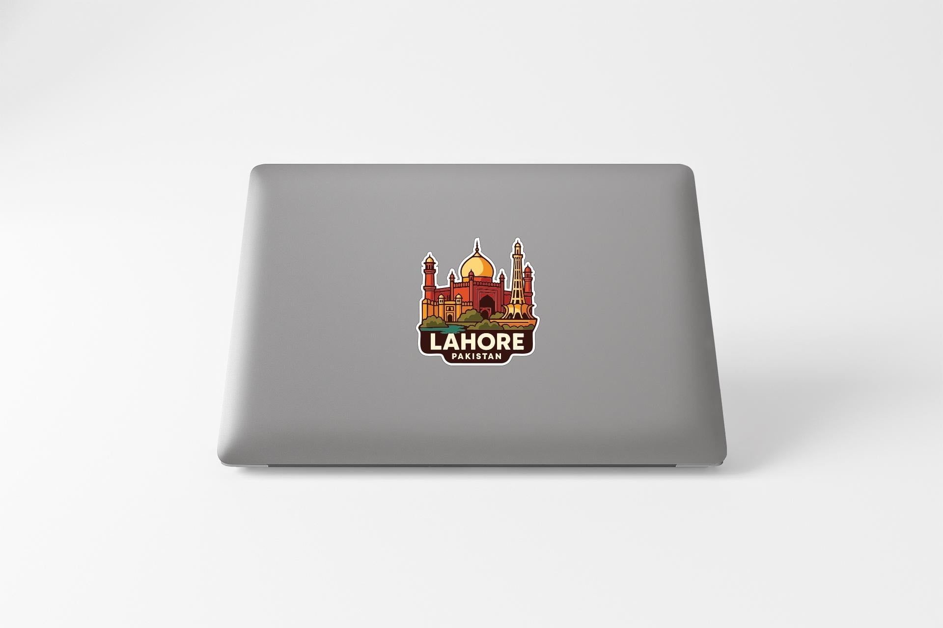 A sticker featuring an illustration of a building with a dome and towers, along with the text "LAHORE PASITAN" printed on it.