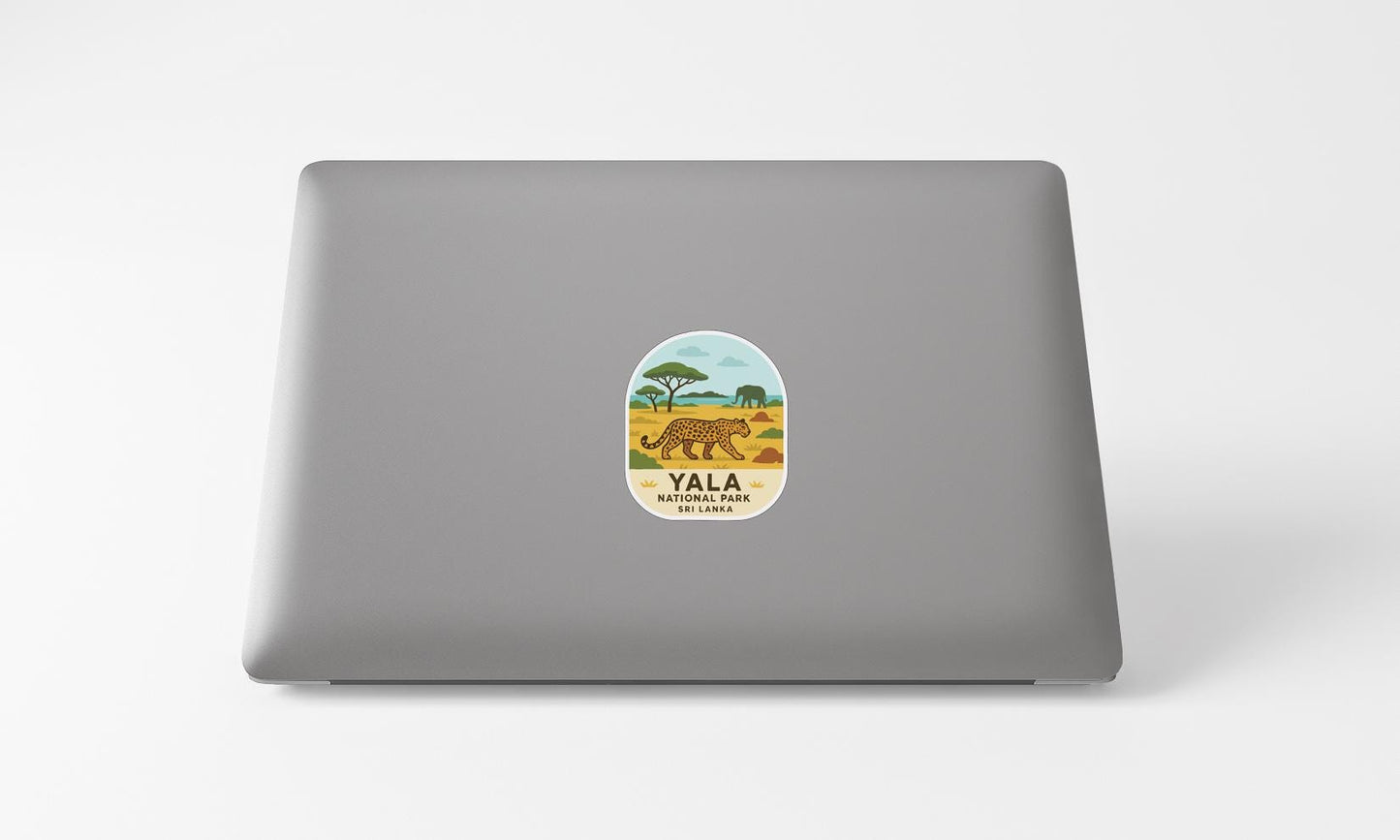 A sticker on the back of a laptop with an illustration of a leopard and the text "YALA NATIONAL PARK" printed on it.