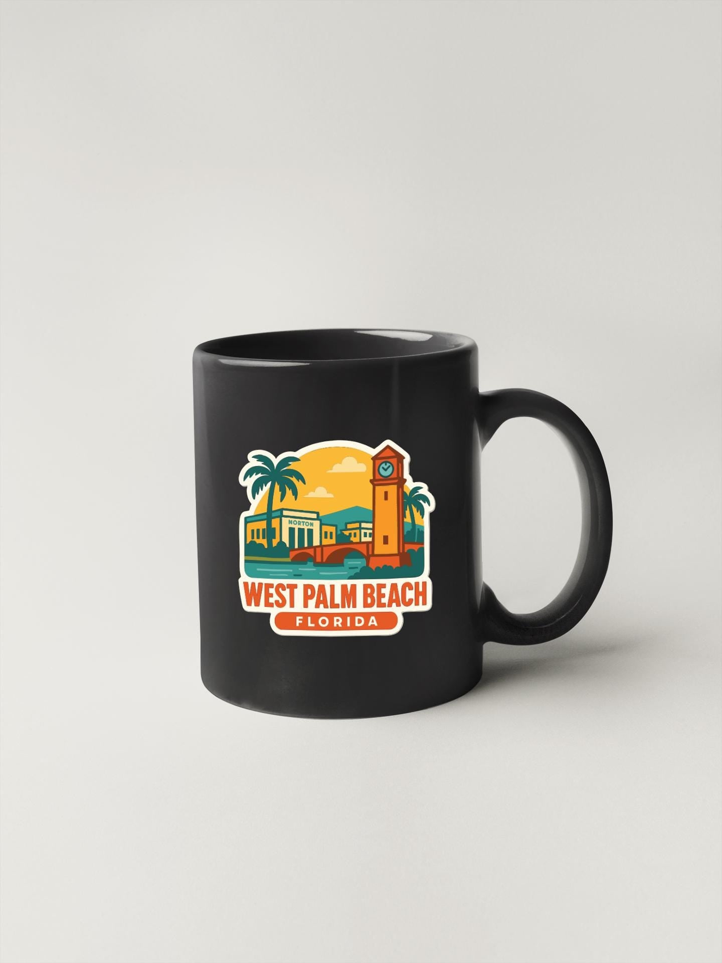 A black coffee mug with a colorful illustration of West Palm Beach, Florida, featuring a clock tower, palm trees, and a sunset.