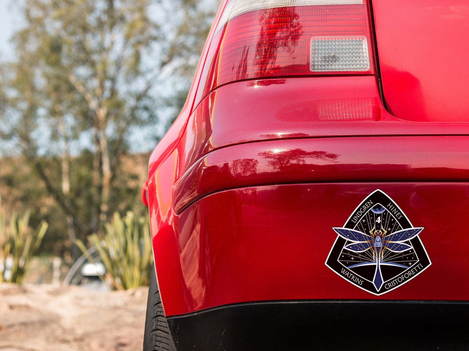 a close up of the tail end of a red car