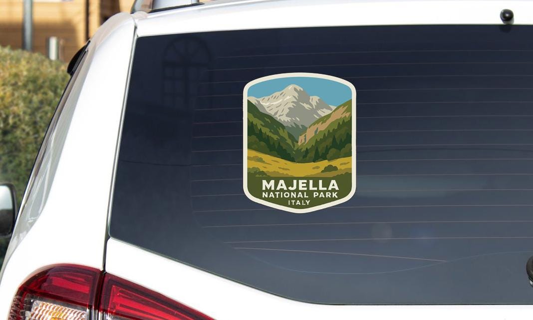 a sticker on the rear window of a car that says "Majella National Park Italy".