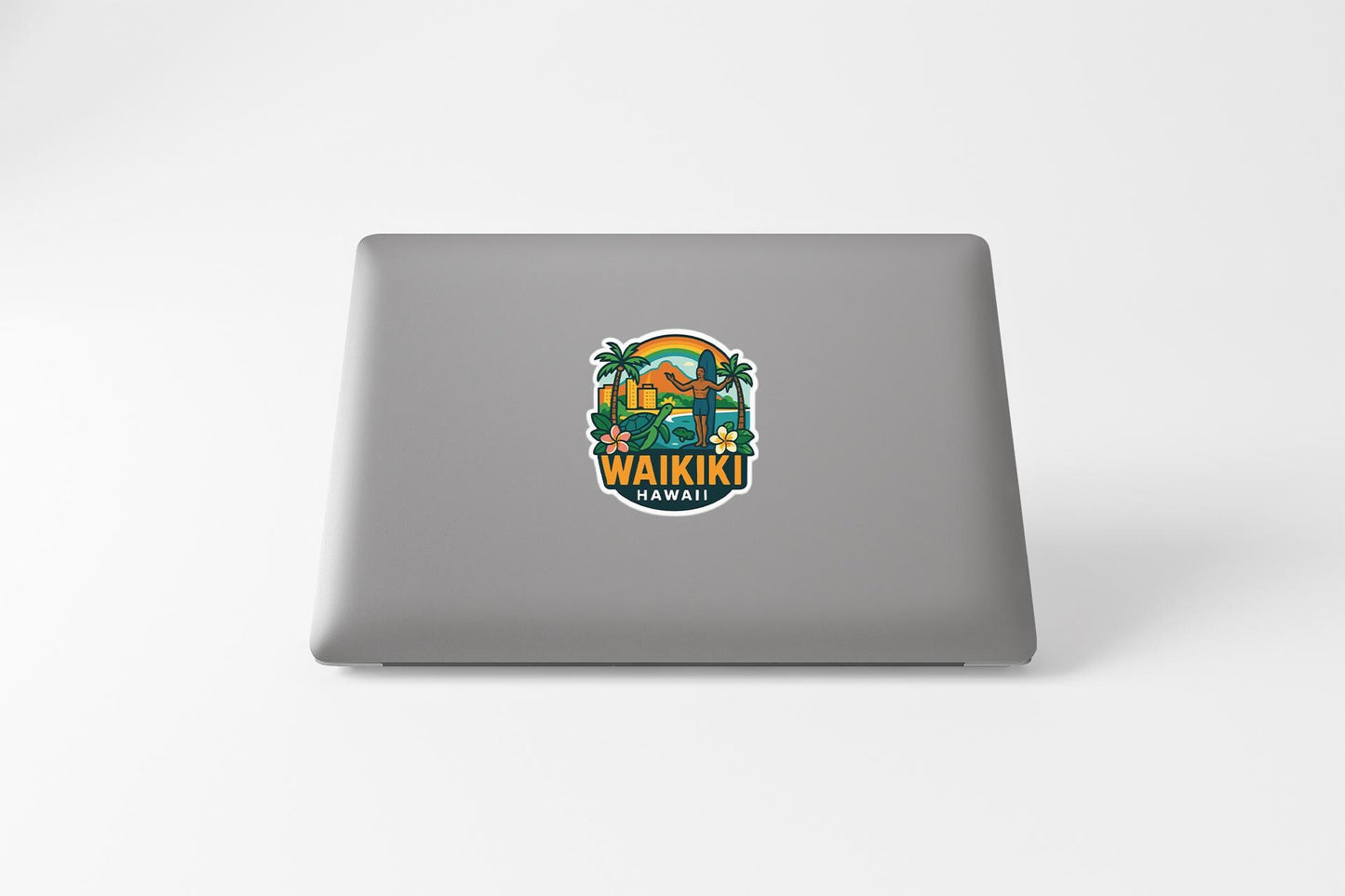 a laptop with a sticker of a picture of a man on a surfboard