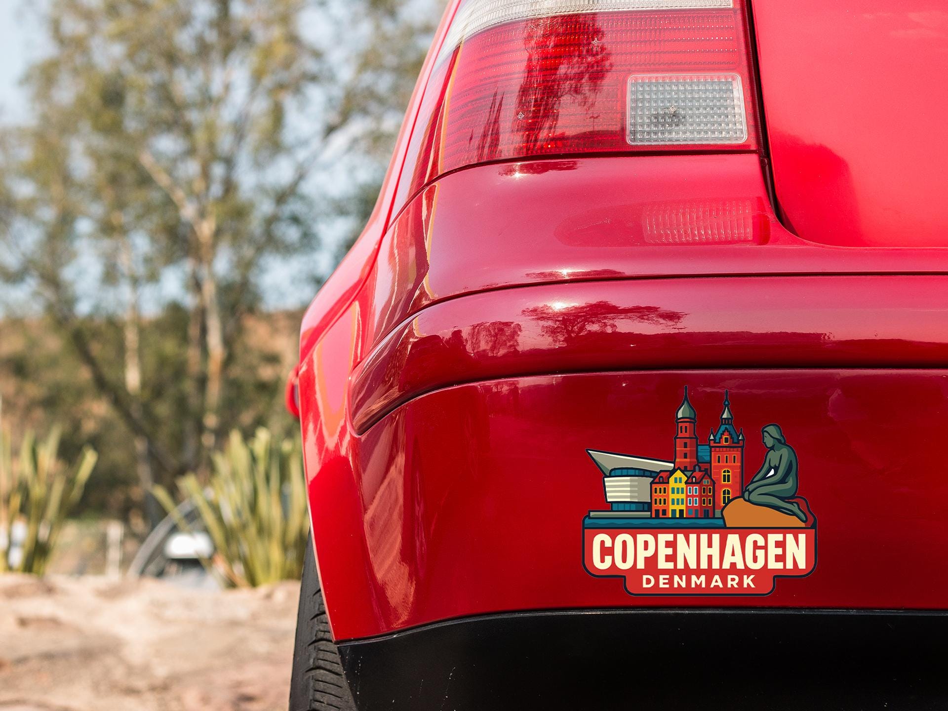 a close up of the rear end of a red car
