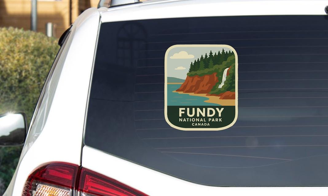 a sticker on the rear window of a car that says "Fundy National Park Canada".