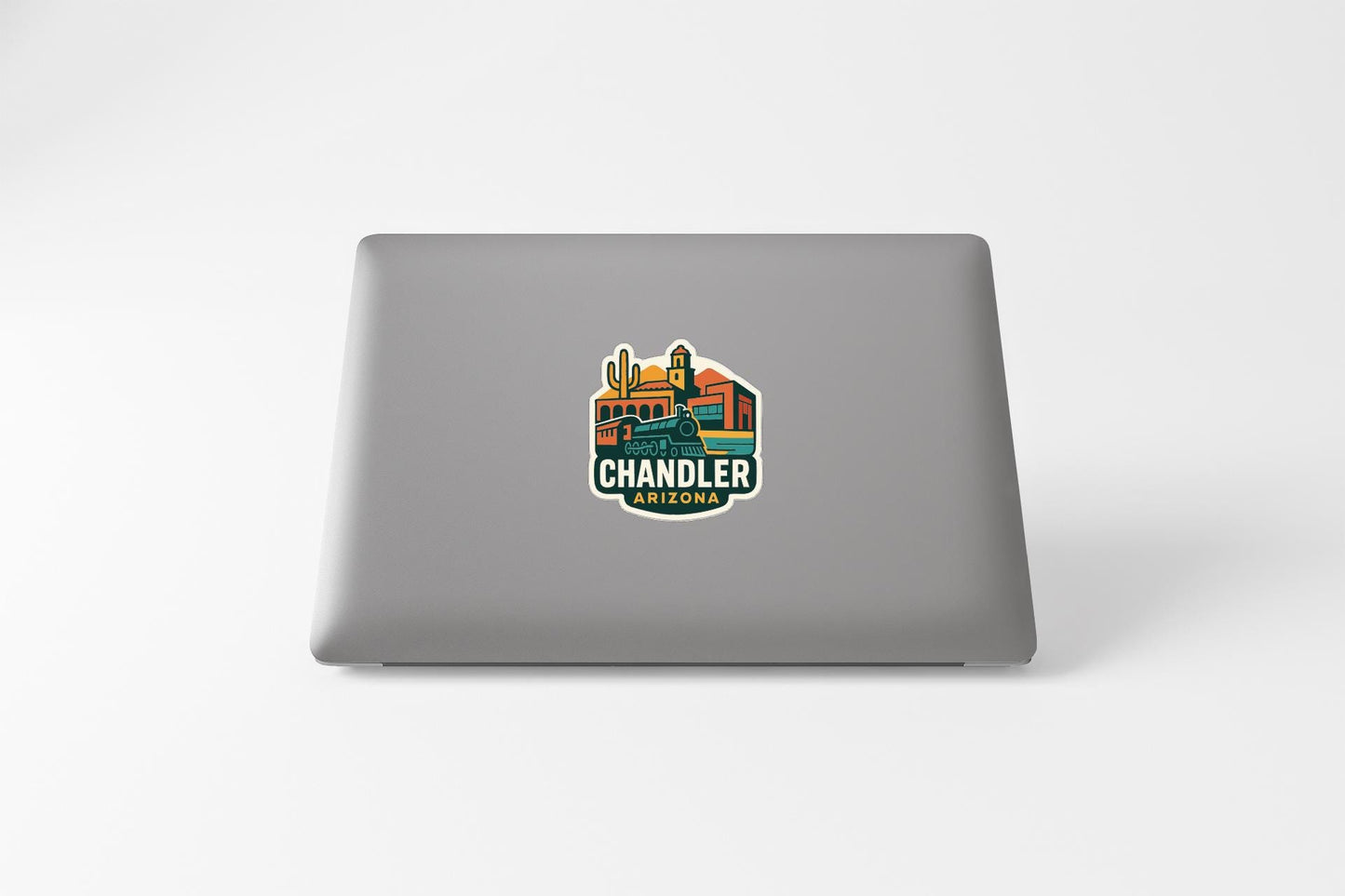 a sticker on the back of a laptop that says "Chandler Arizona".