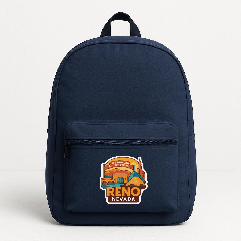 A navy blue backpack with a colorful graphic of Reno, Nevada on the front.