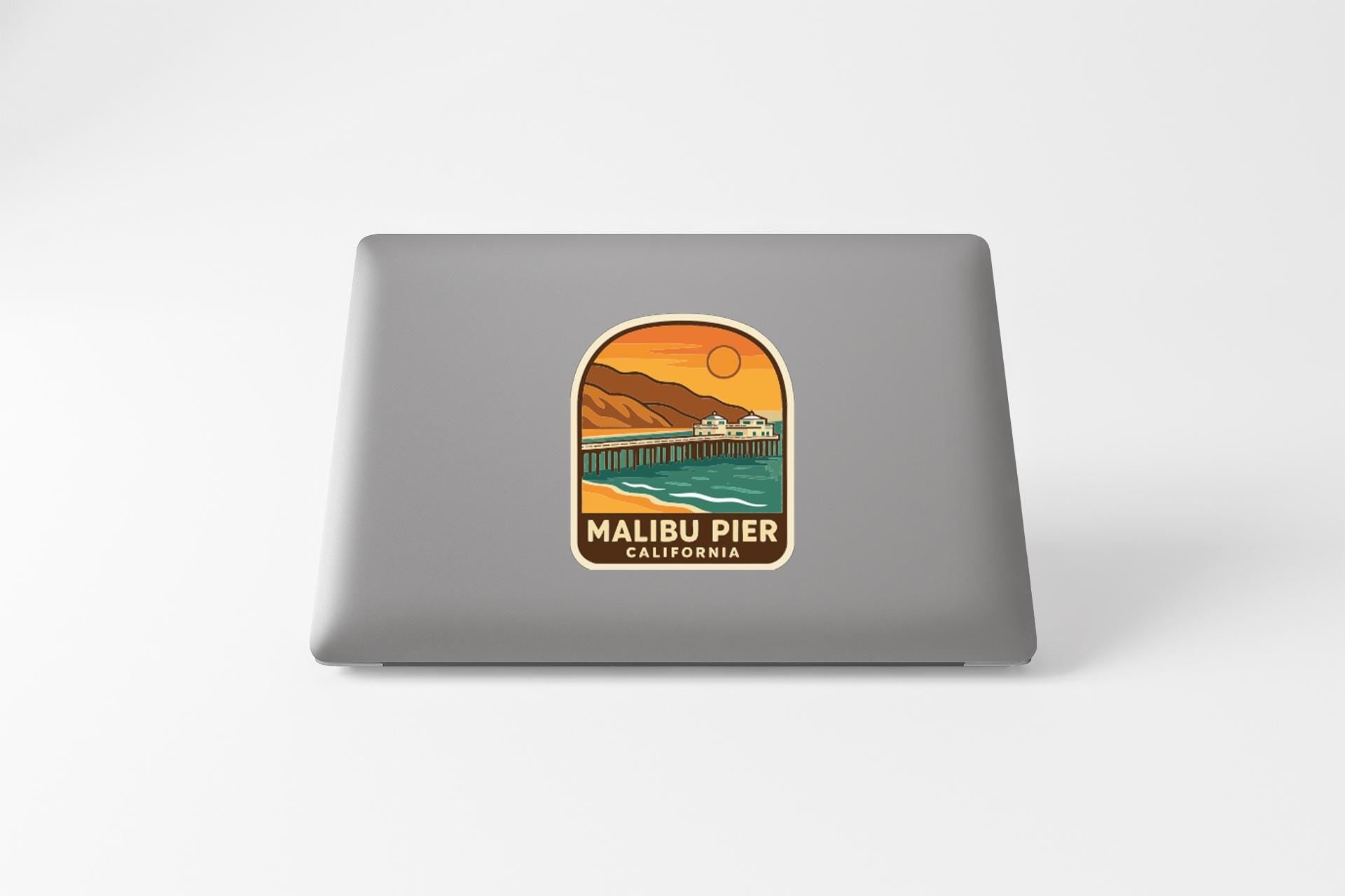 a sticker with a scenic view of the Malibu Pier in California.