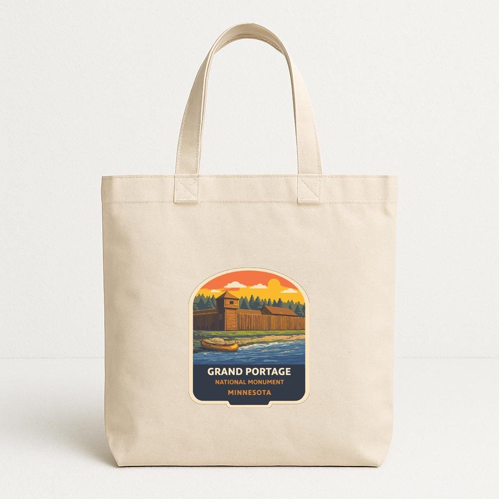 A beige tote bag with a printed label that says "GRAND PORTAGE NATIONAL PARK MINNESOTA".