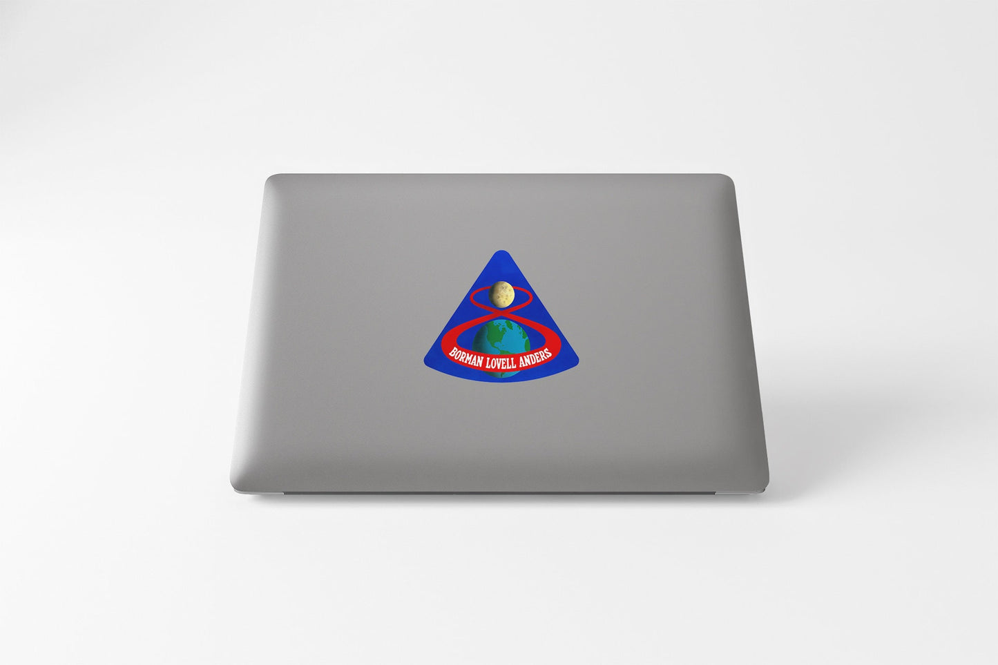 a laptop computer with a sticker of a triangle
