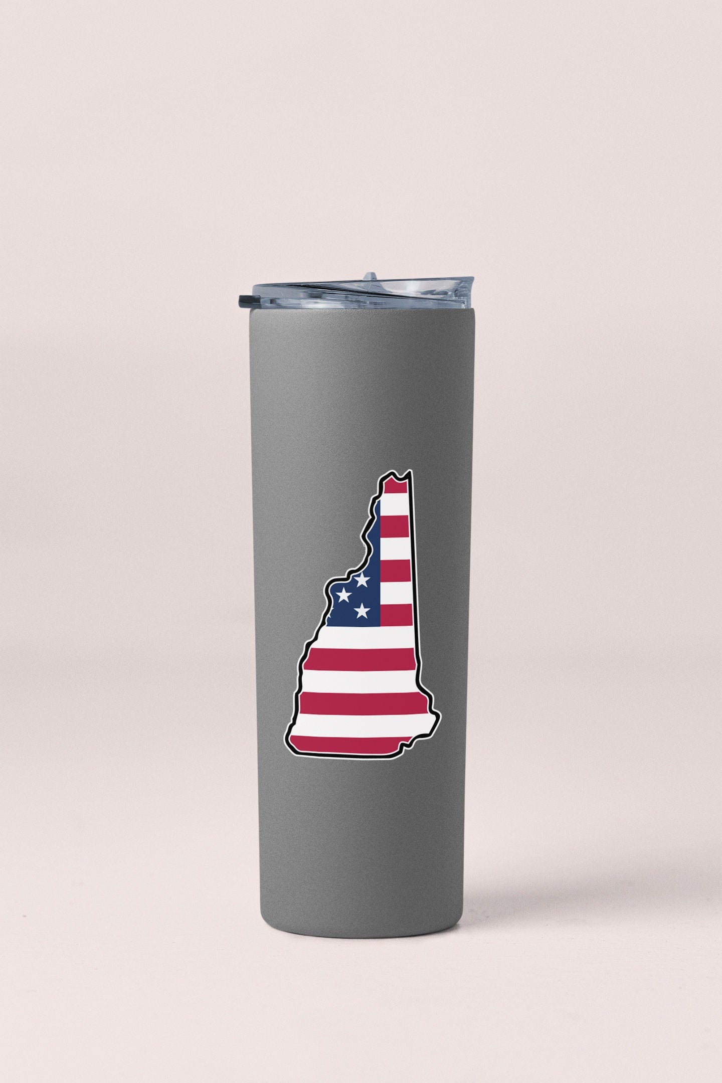 a stainless steel tumbler with a picture of the state of new hampshire on it