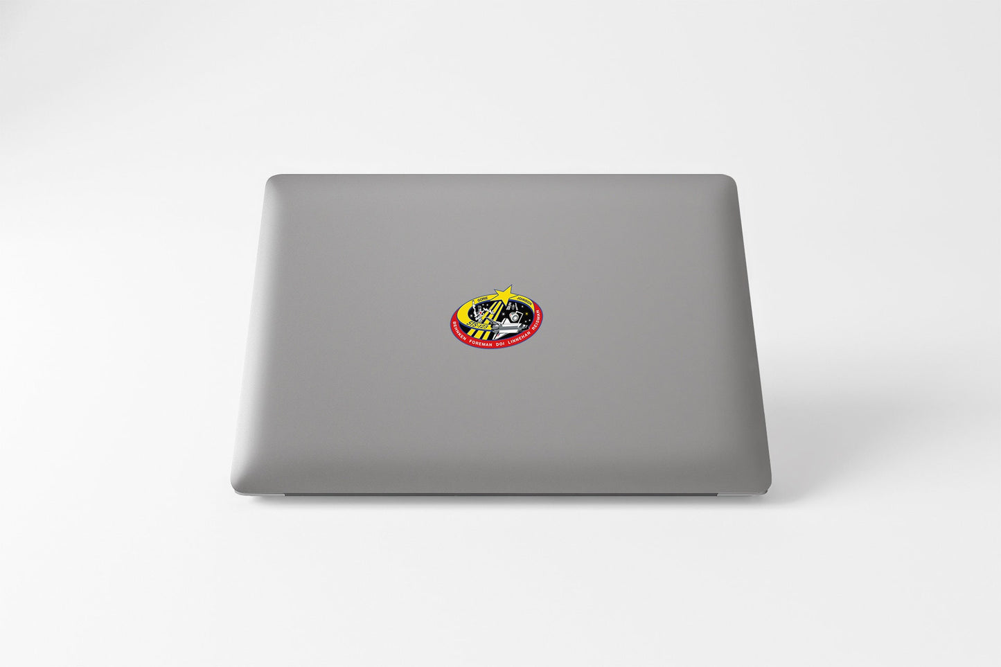 a laptop with a sticker of a dog on it