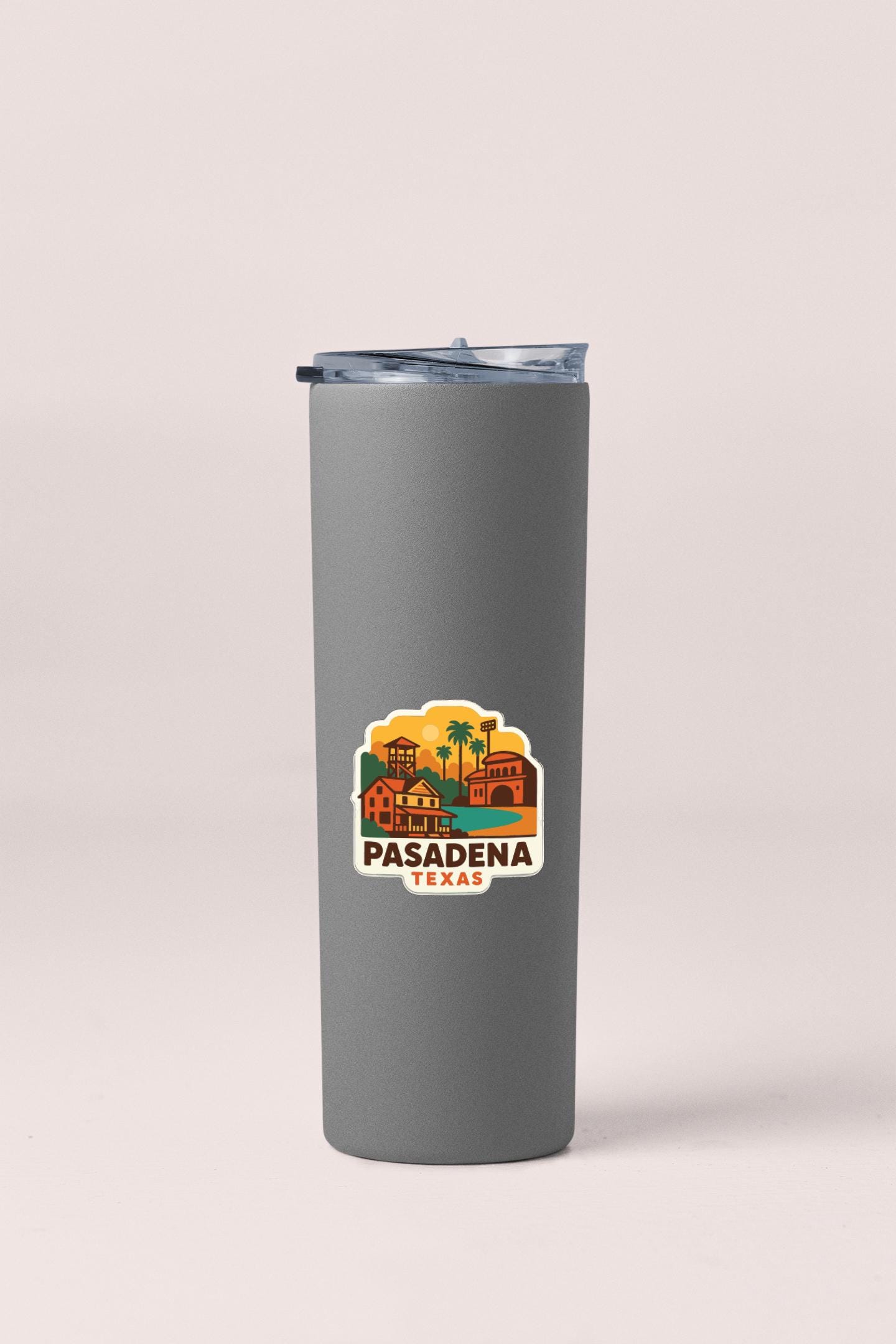 A gray insulated tumbler with a lid and a sticker featuring a colorful illustration of a cityscape with palm trees and buildings.