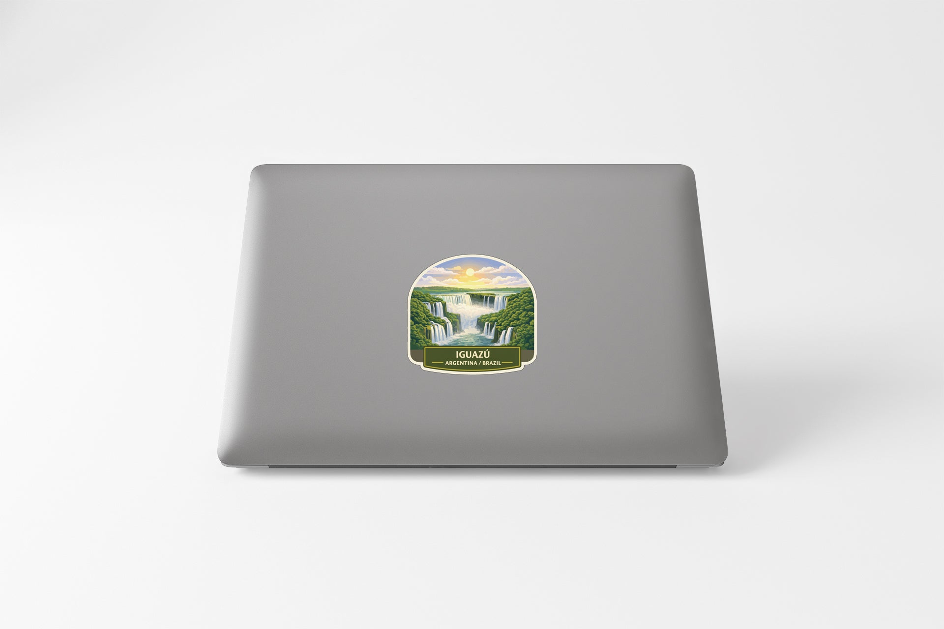 A sticker depicting a waterfall surrounded by lush greenery, with the text "ZUGUN" visible.