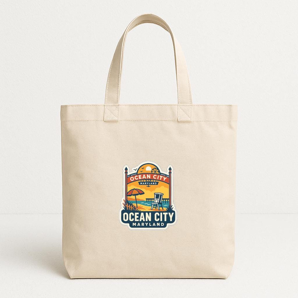 A beige tote bag with a printed design depicting a beach scene and the text "OCEAN CITY, MARYLAND".