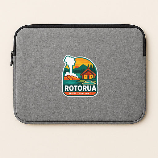 A gray laptop sleeve with a logo of Rotorua, New Zealand, featuring a mountain landscape and a house.