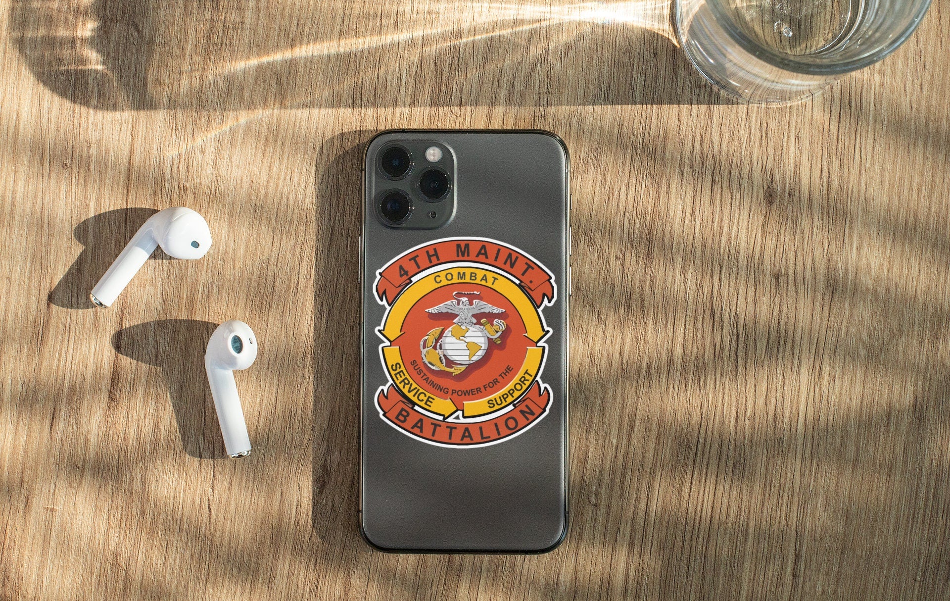 a cell phone sitting on top of a wooden table