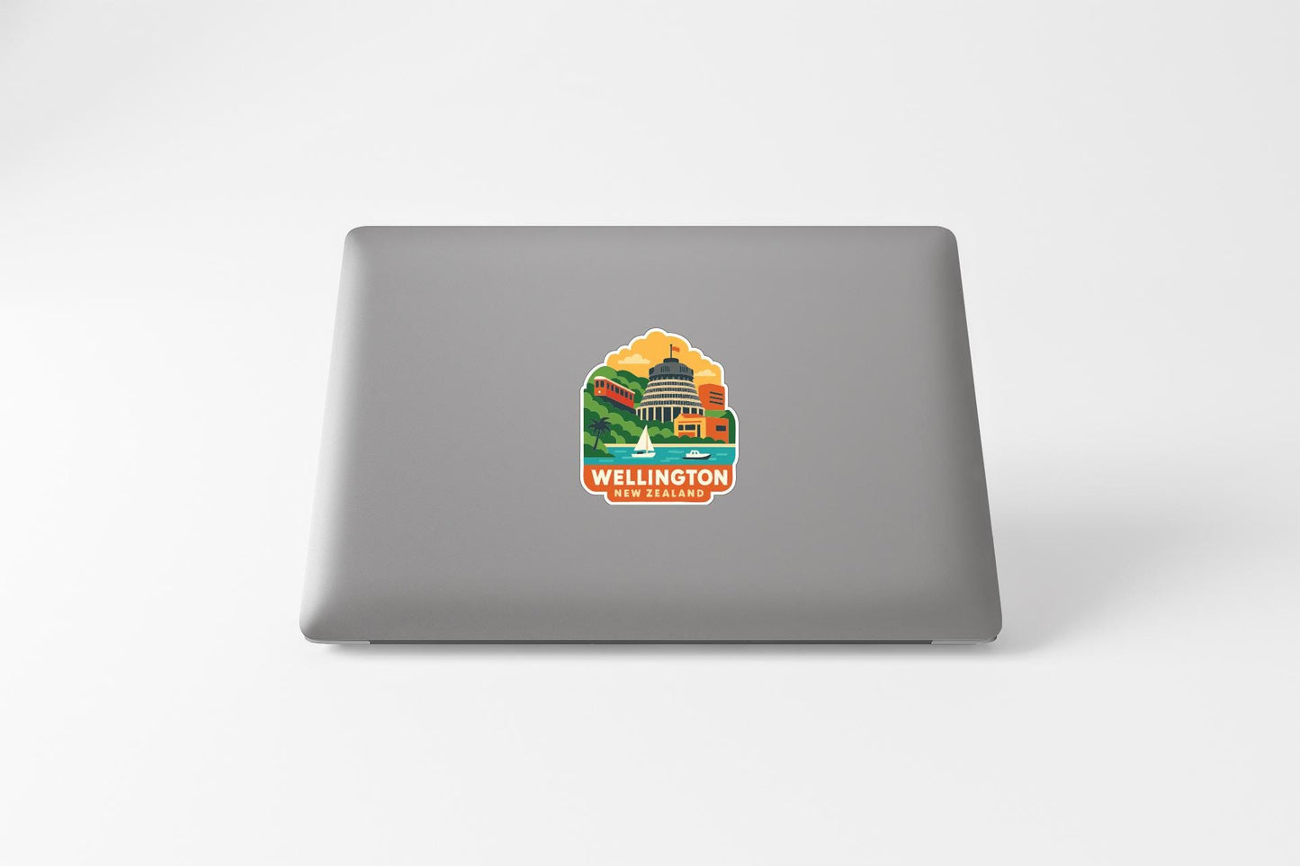 a sticker of Wellington, New Zealand, on the back of a laptop computer.