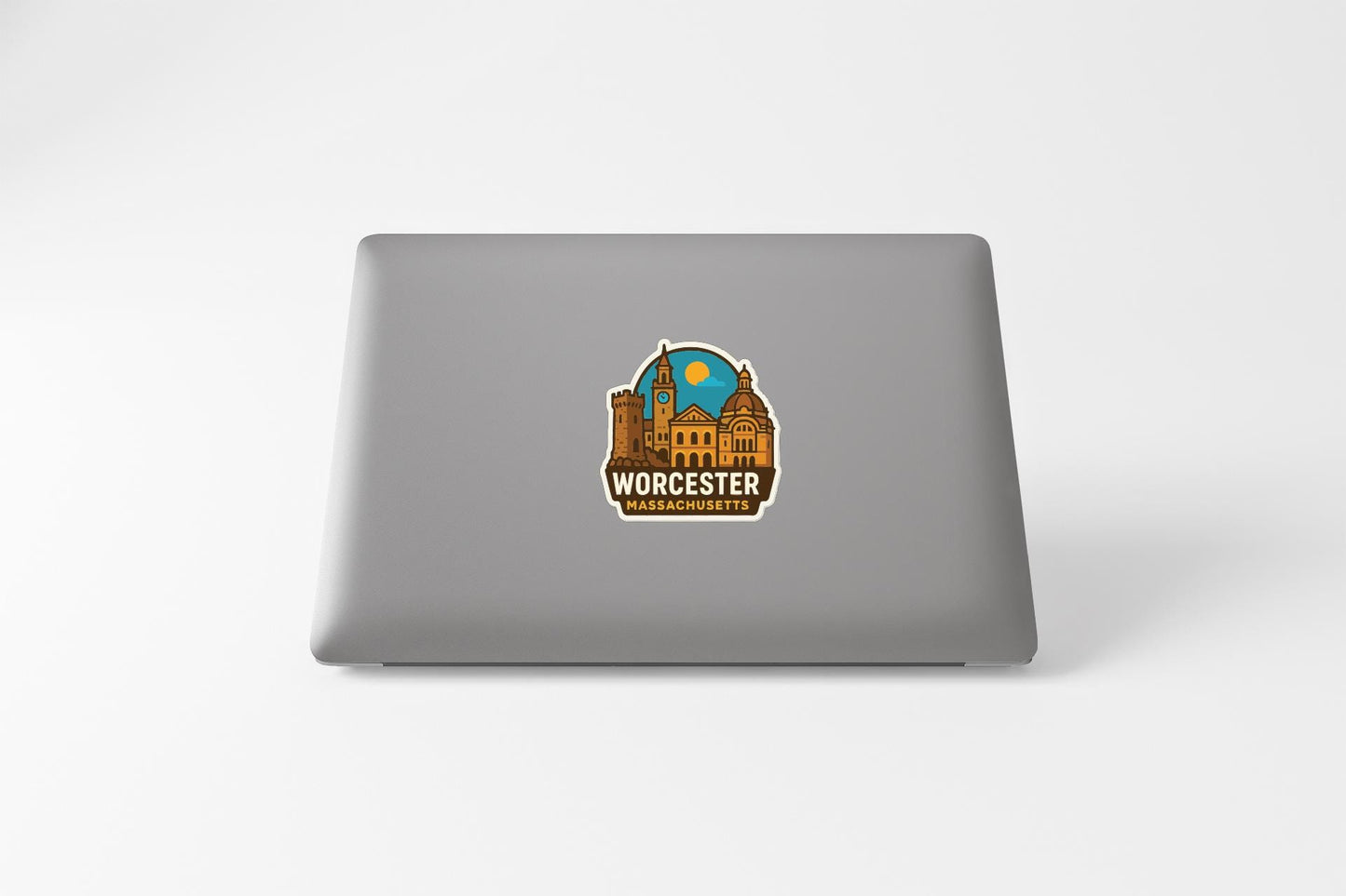 a sticker of the city of Worcester, Massachusetts, on the back of a laptop.