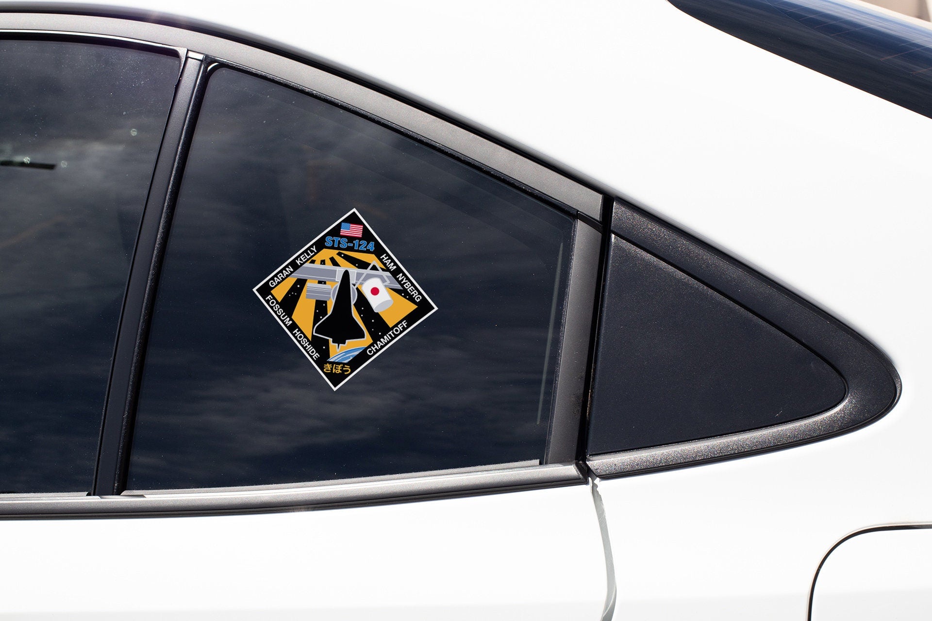 a sticker on the side of a white car