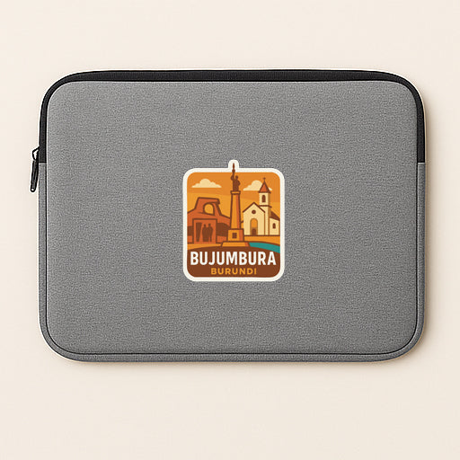 a gray laptop sleeve with a sticker of the city of Bujumbura, Burundi, printed on it.