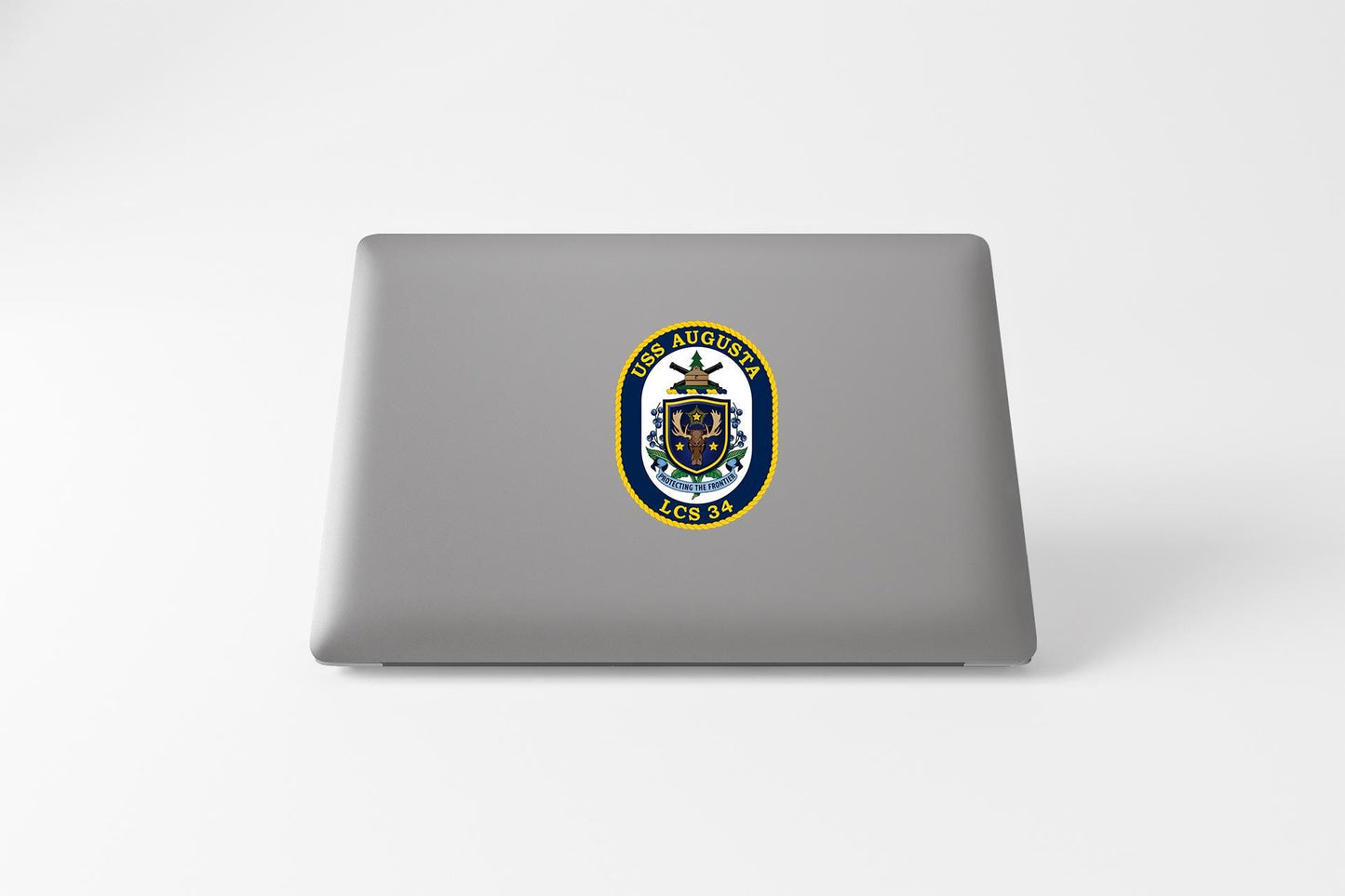 a laptop computer with a coat of arms on it